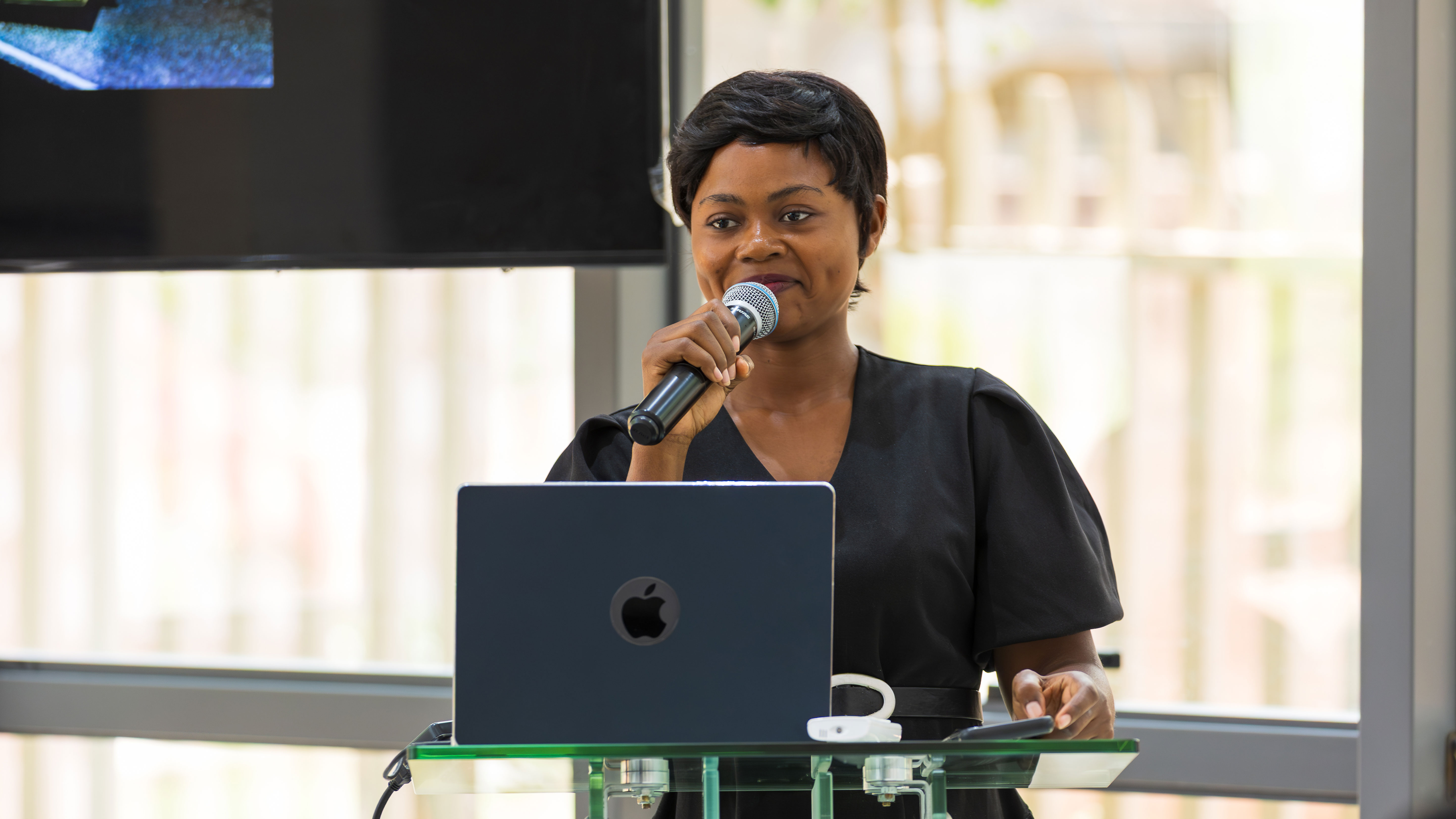 Speaker at a formal COME-related event