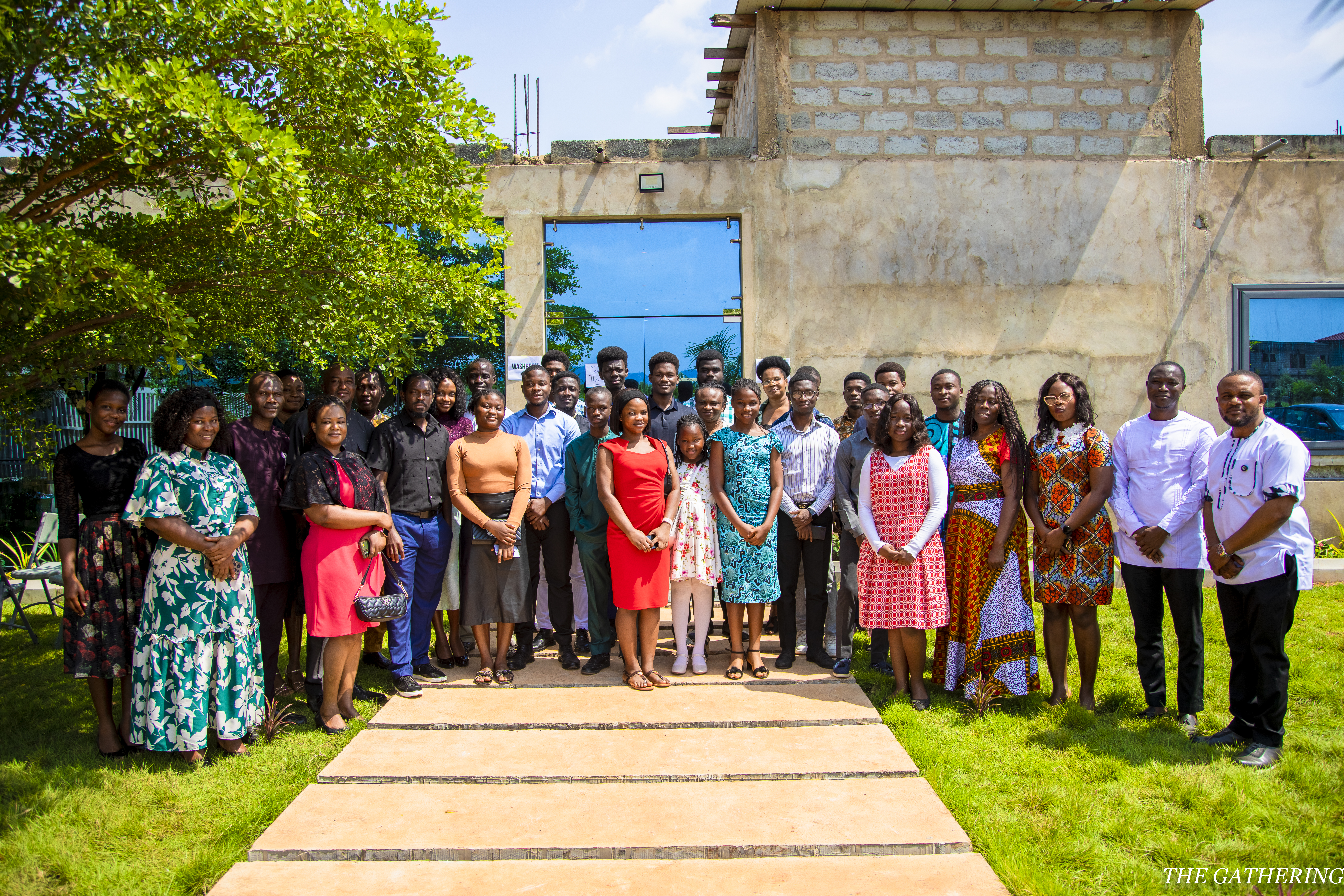 Community members together outdoors, representing field outreach and local programs.