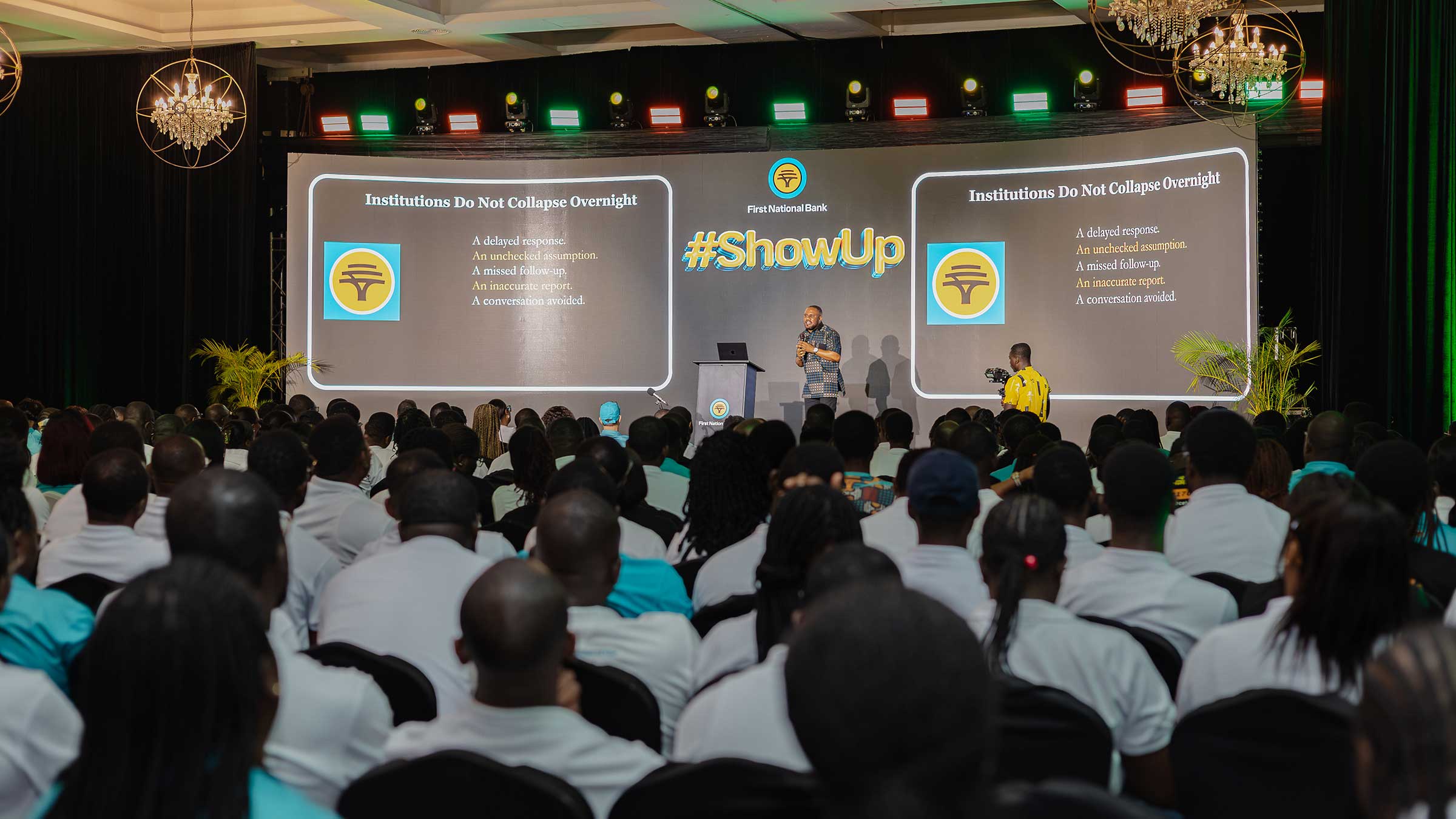 Godswill T.K. Mensah presenting at the 2026 First National Bank Ghana Townhall Meeting